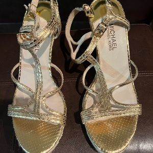Michael Kors wedge sandal in gold. Never worn.